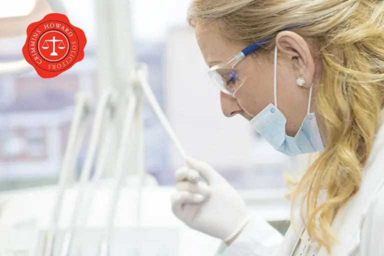 A masked laboratory technician handling a sample, with the Crimmins Howard seal